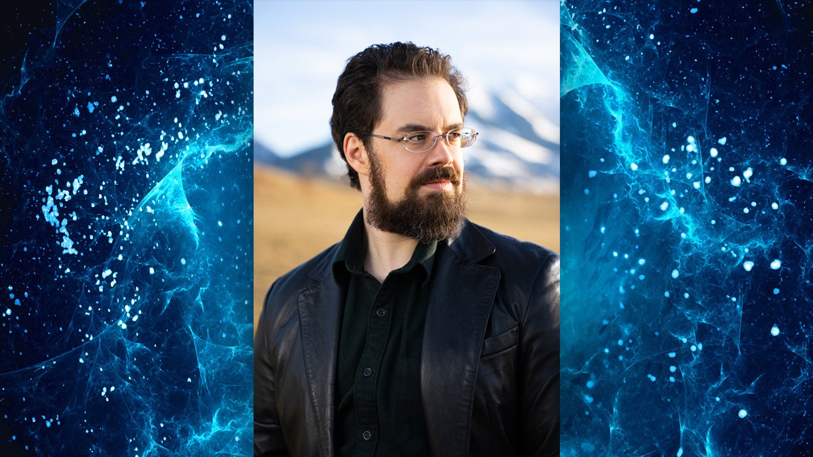 Photo of Christopher Paolini against a blue space background