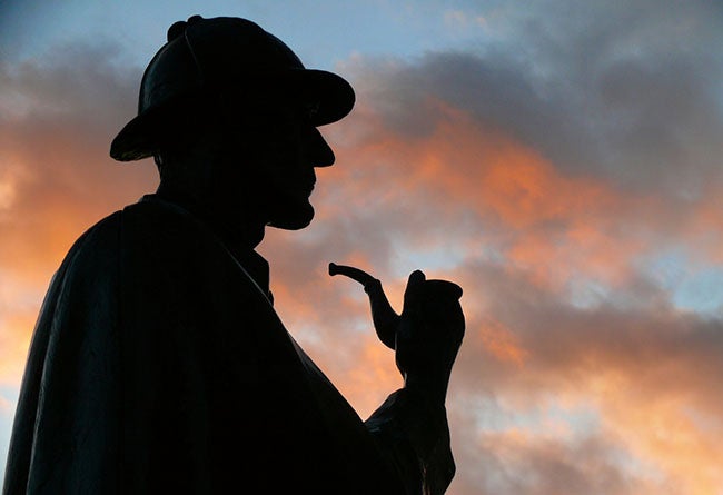 Sherlock Holmes silhouette with sunset