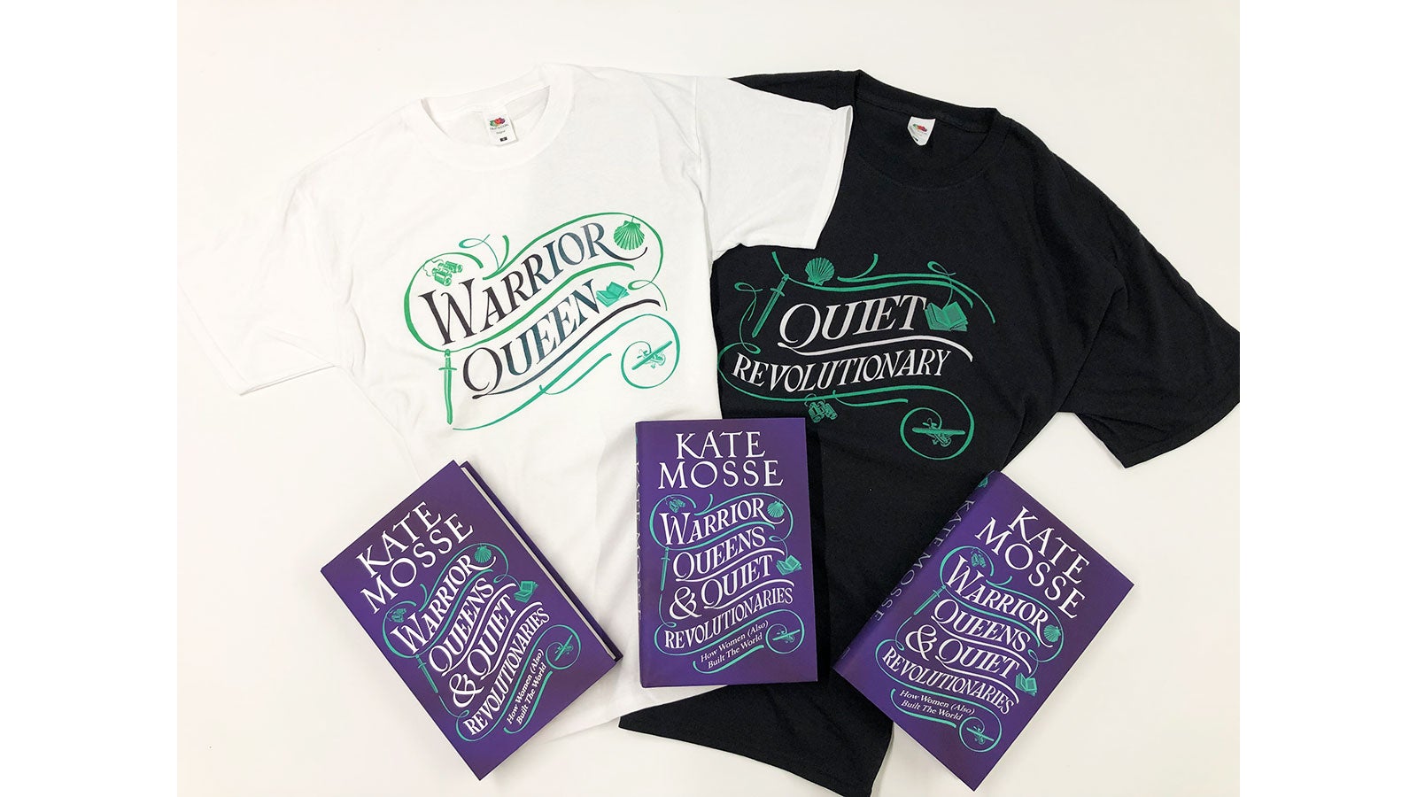 Three copies of Warrior Queens & Quiet Revolutionaries by Kate Mosse rest on a white t-shirt with Warrior Queens on the front and a black t-shirt with Quiet Revolutionaries on the front.