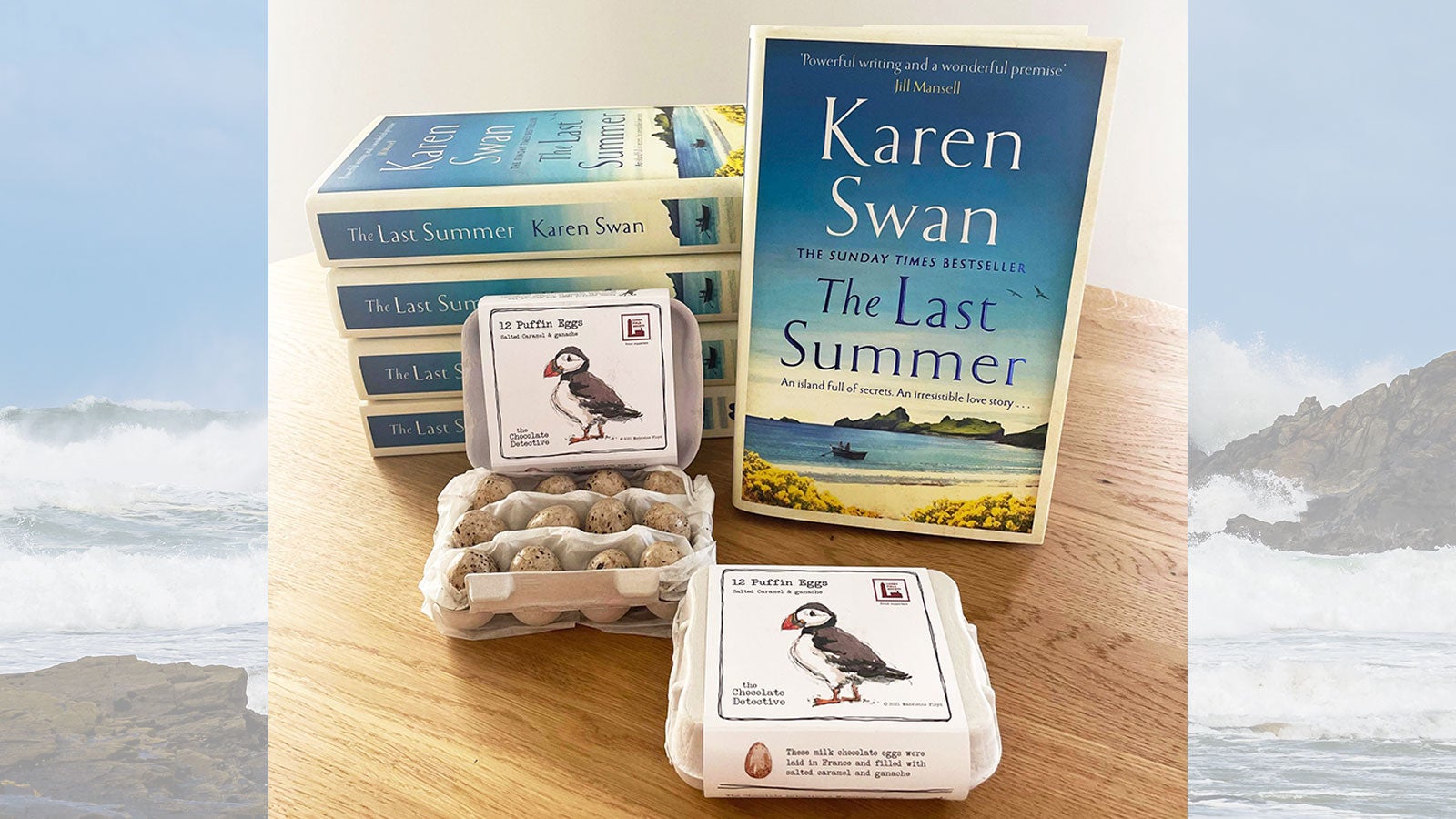 A photograph of five copies of Karen Swan's The Last Summer with some chocolate puffin eggs from The Chocolate Detective.