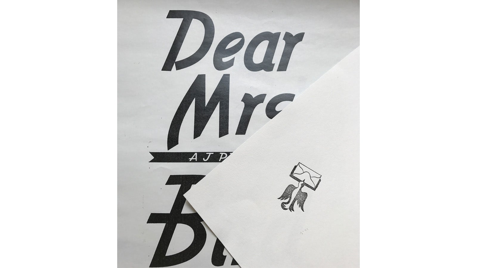 The typography of Dear Mrs Bird is sketched on an envelope design. The typography of Dear Mrs Bird is sketched on an envelope design.