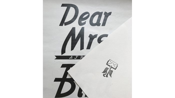 The typography of Dear Mrs Bird is sketched on an envelope design.