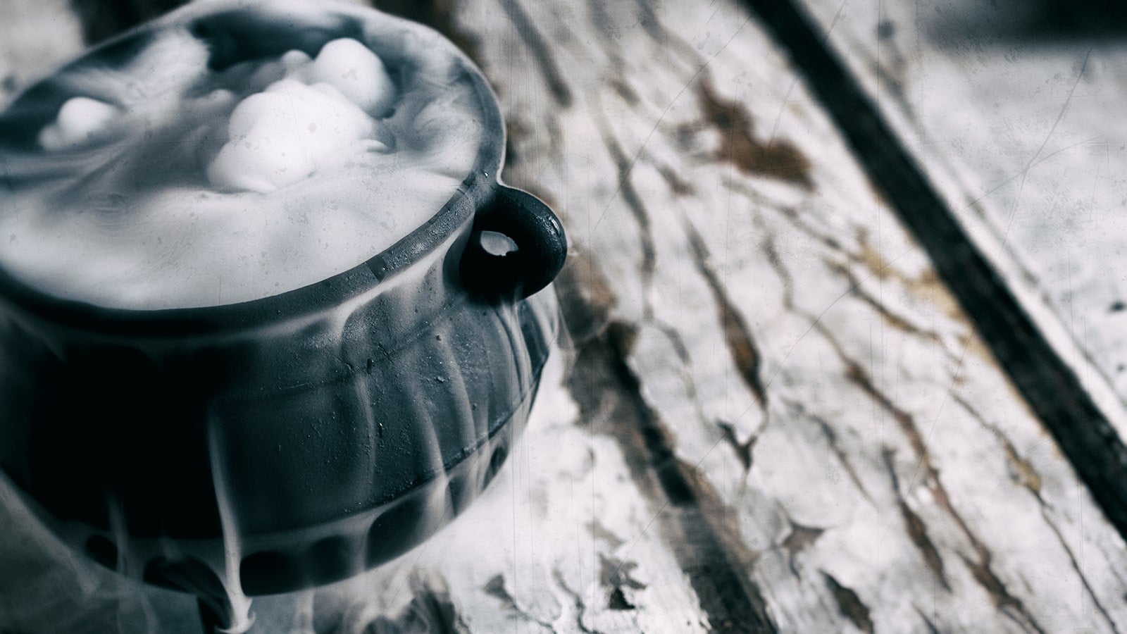 Cauldron bubbling on a wooden table