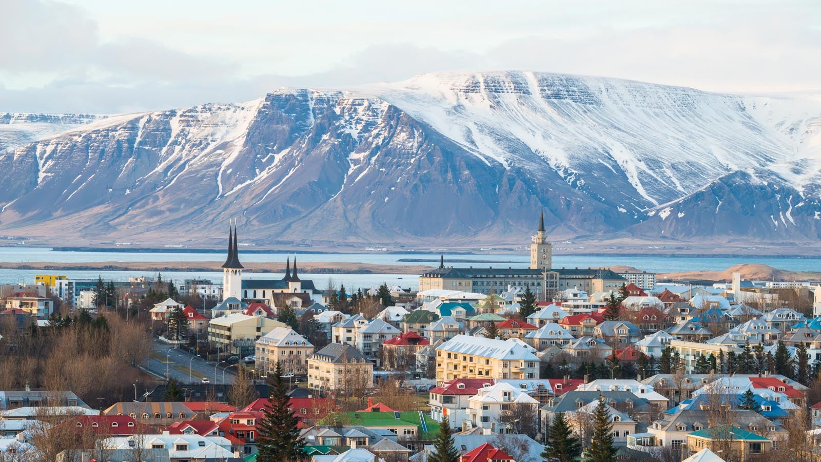 Nordic landscape showing town and snowy mountains