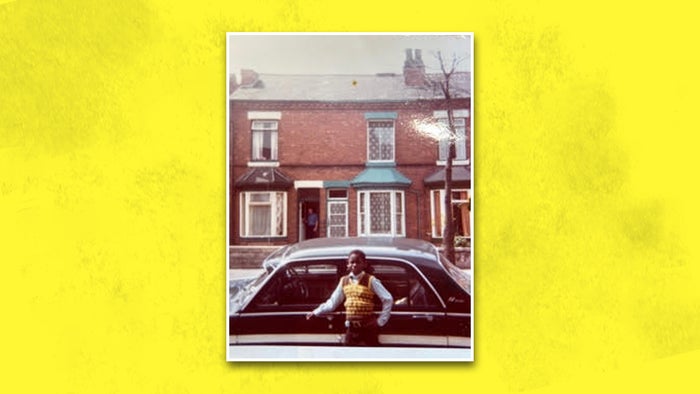 A photo of a young David Harewood standing in front of a car on the streets of Birmingham. The photo is on a yellow background.