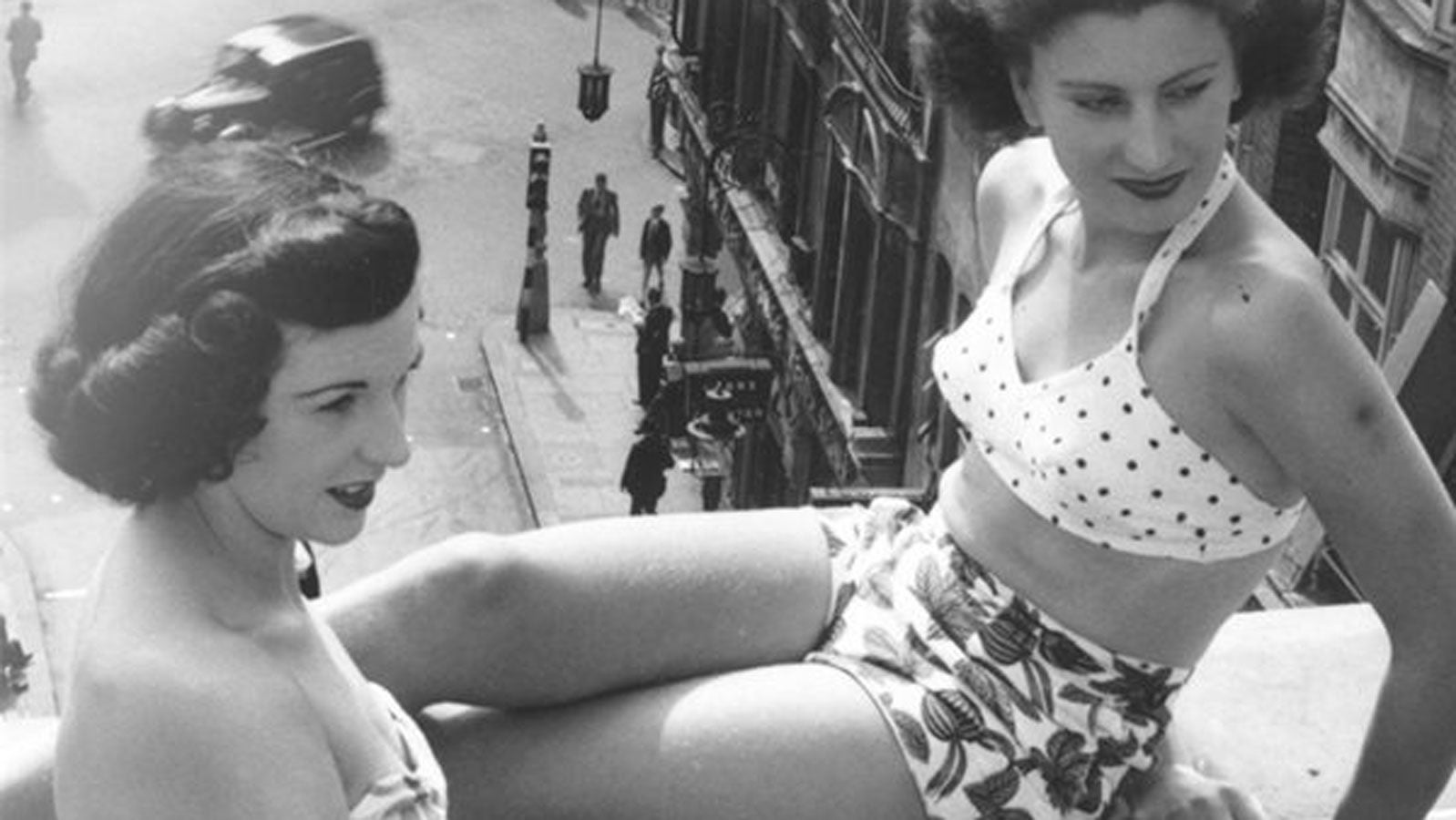 Two girls in bikinis on a rooftop/balcony in London in the 1940s
