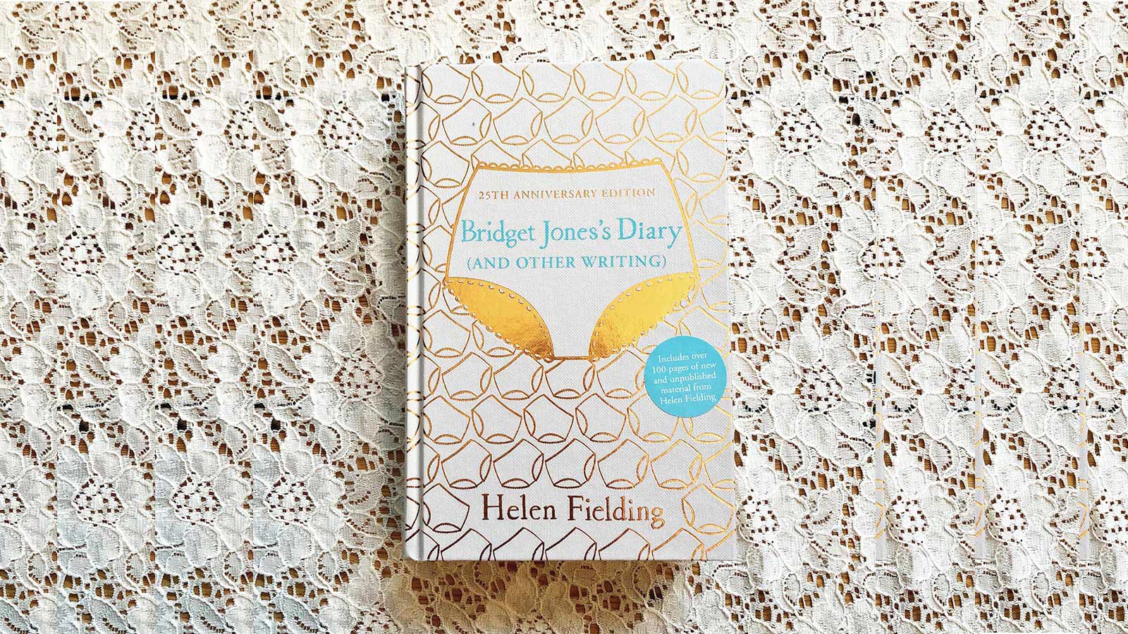 The book cover of Bridget Jones's Diary against a white lace background