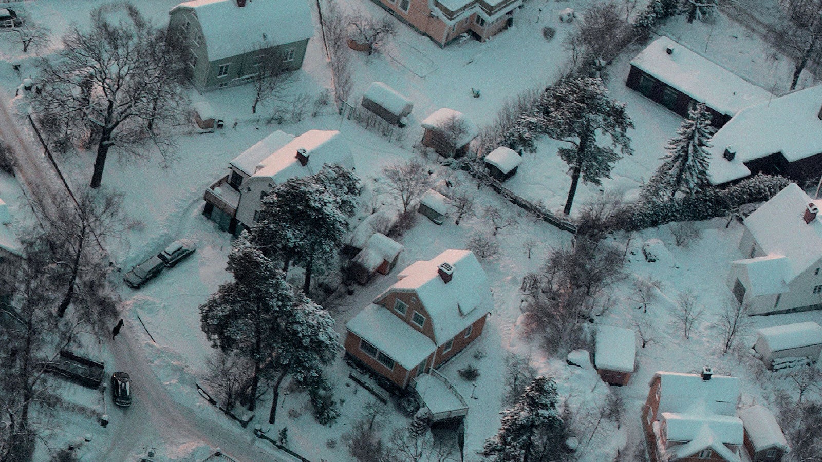 Aerial photograph of an American town covered in snow.