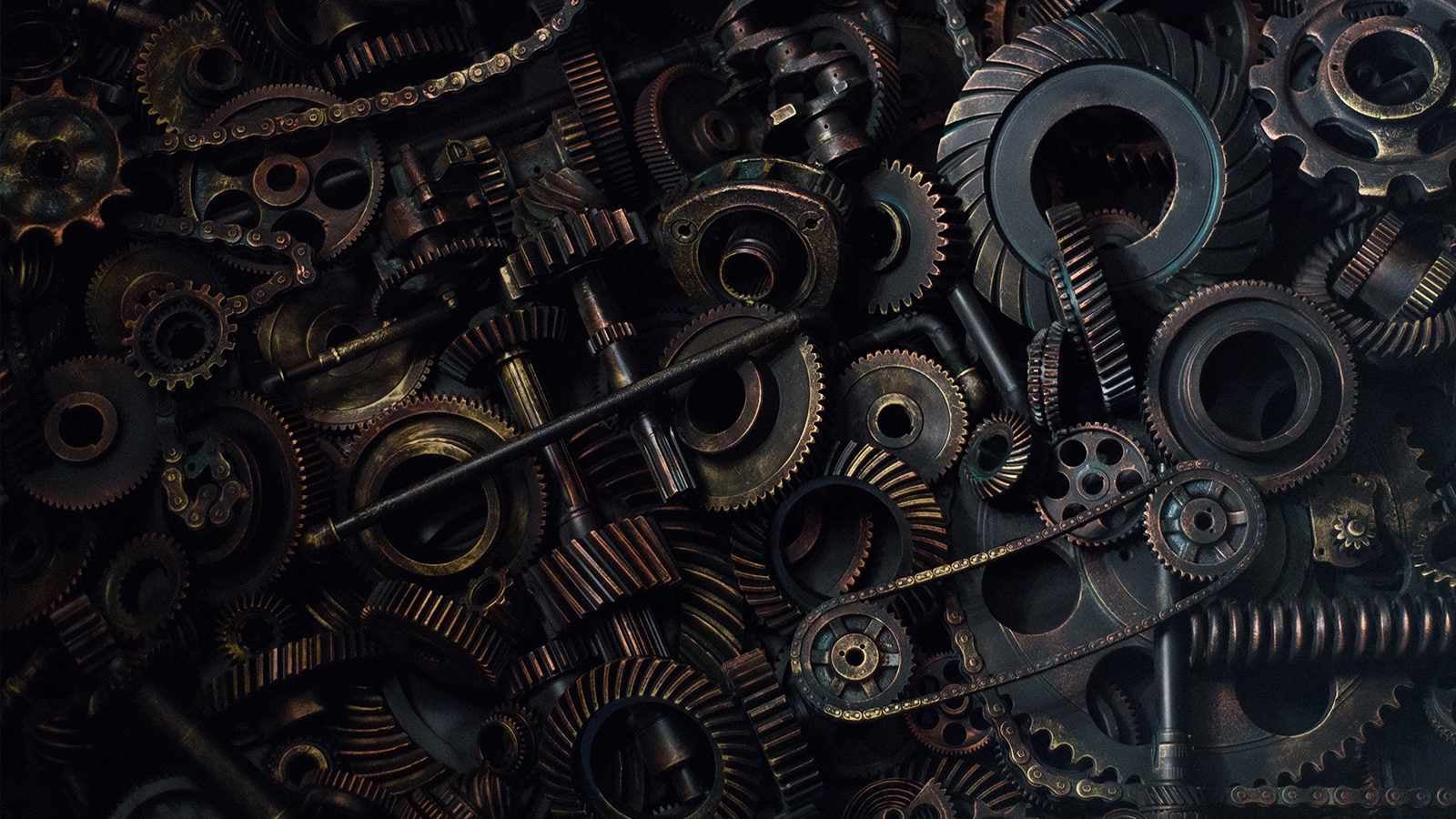 Close up image of cogs and mechanical chains 