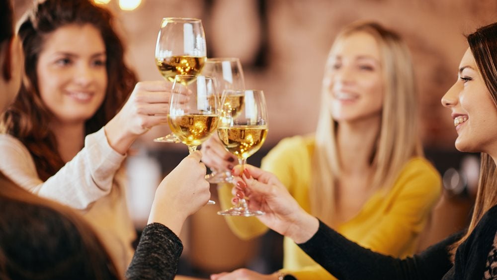 Women drinking white wine