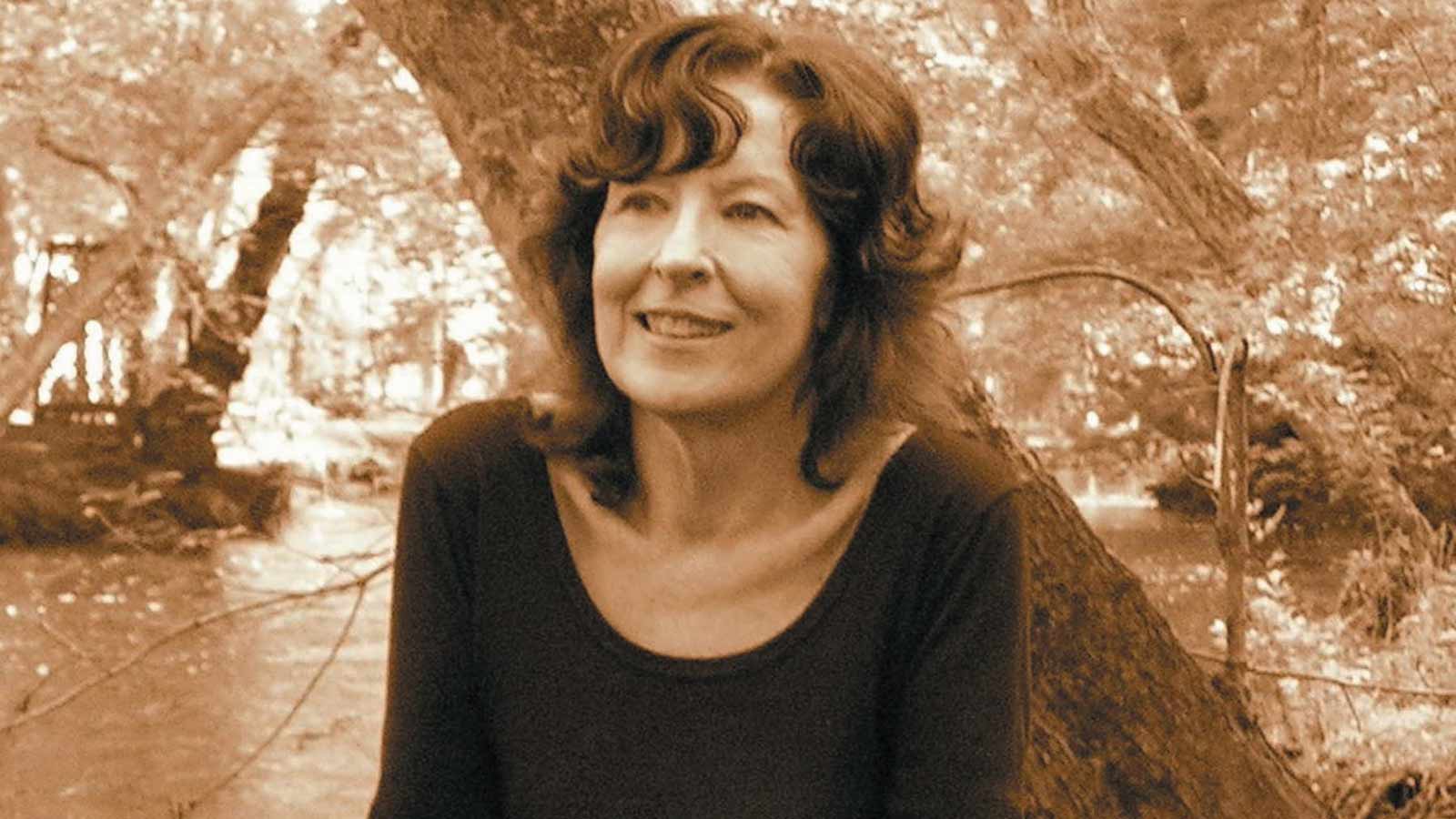 A sepia photograph of Sharon Penman smiling