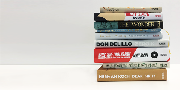 A stack of books that each have beautiful and unique covers. All the books are featured in the article.