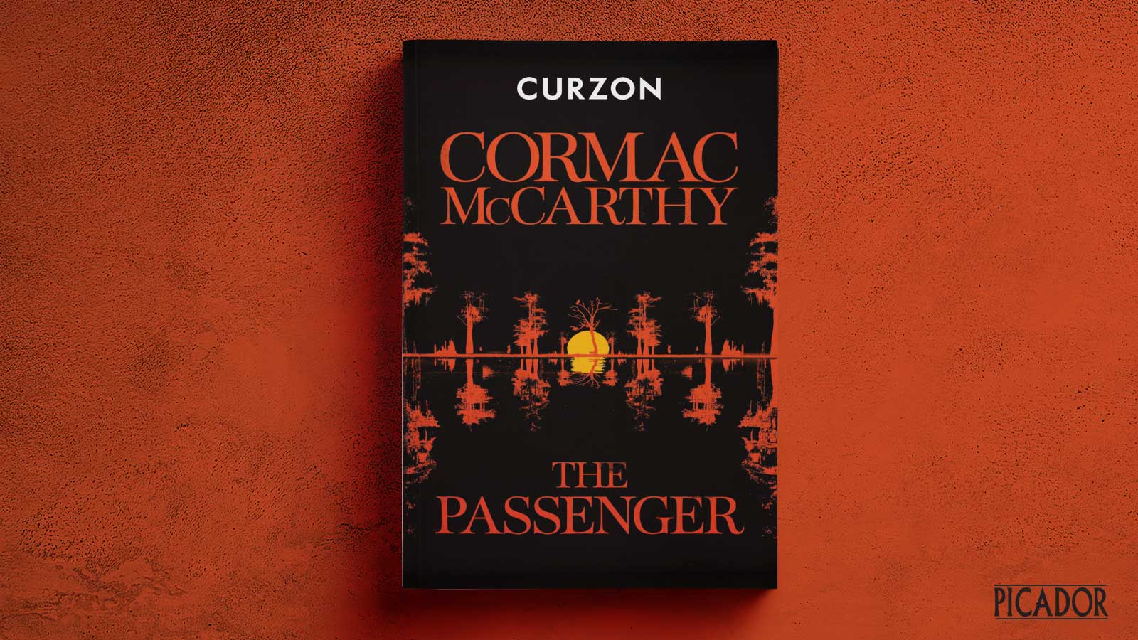 A special proof of Cormac McCarthy's The Passenger on a red background.