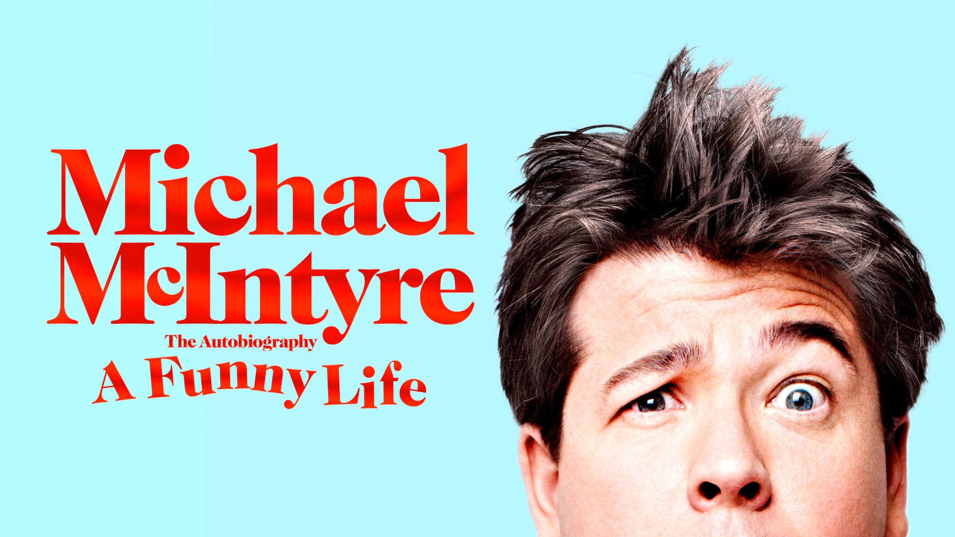 Half of Michael McIntyre's confused face can be seen on a blue background, next to the words 'Michael McIntyre The Autobiography A Funny Life'