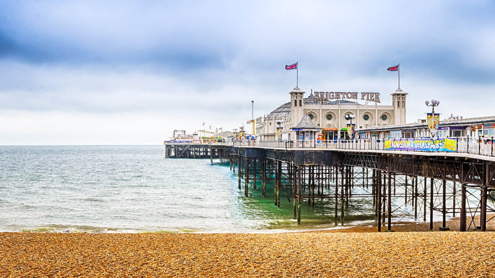 A photograph of Brighton Pier taken from the beach.