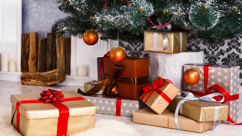 Christmas gifts around the bottom of a tree