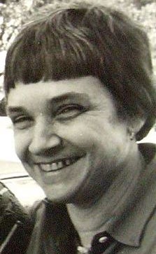 black and white photograph of Adrienne Rich smiling