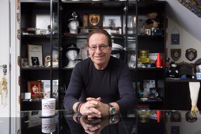 A photo of Peter James sat a table