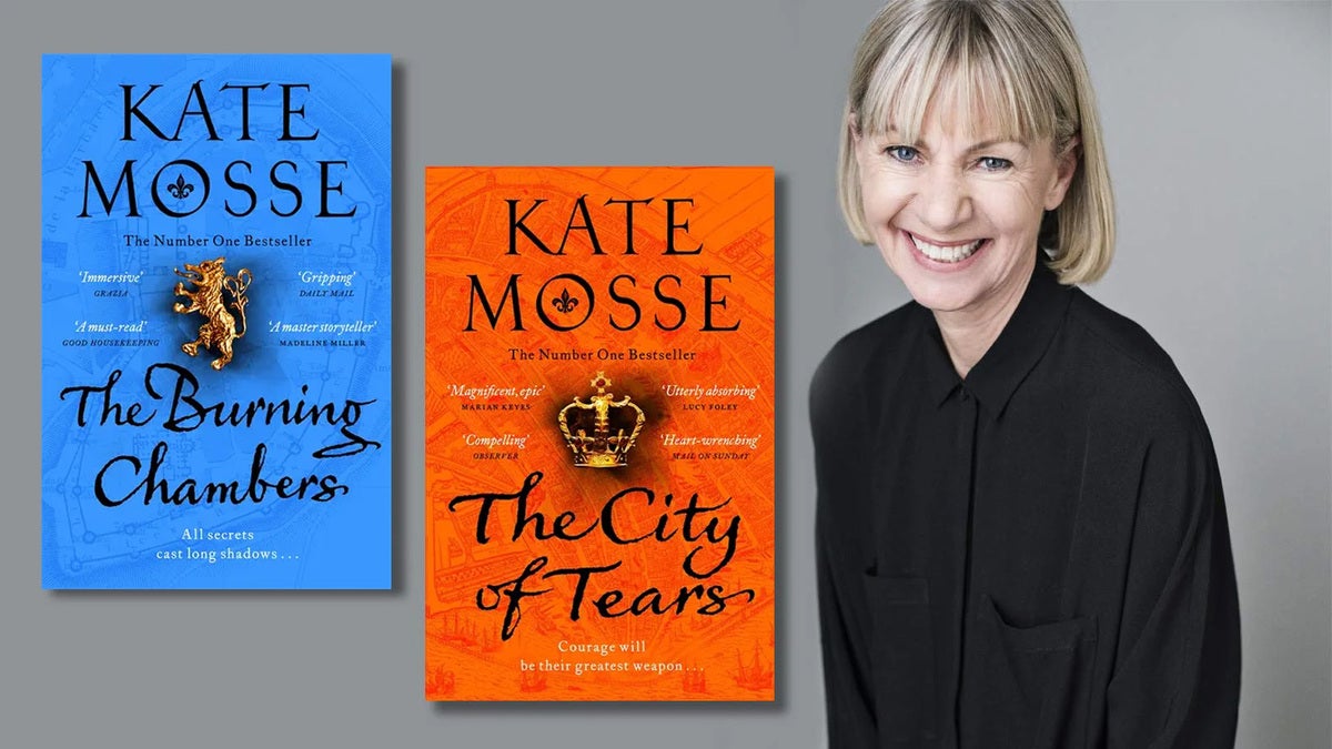 Kate Mosse smiles to camera next to the covers of her books The Burning Chambers and The City of Tears