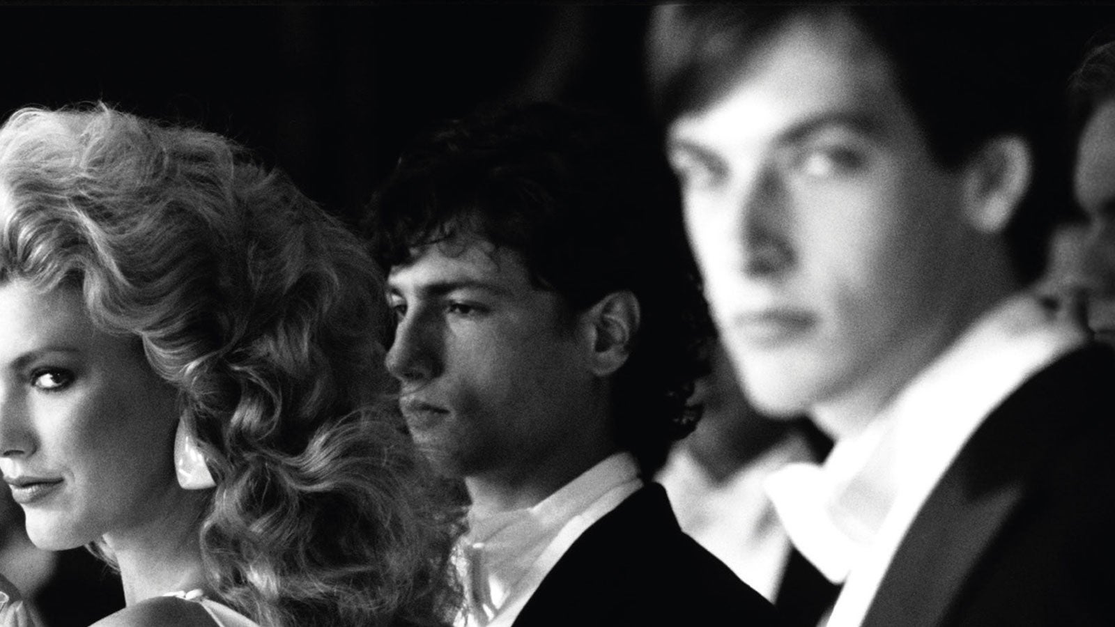 A woman and two men in black tie. A photograph taken from the cover of Alan Hollinghurst's The Line of Beauty
