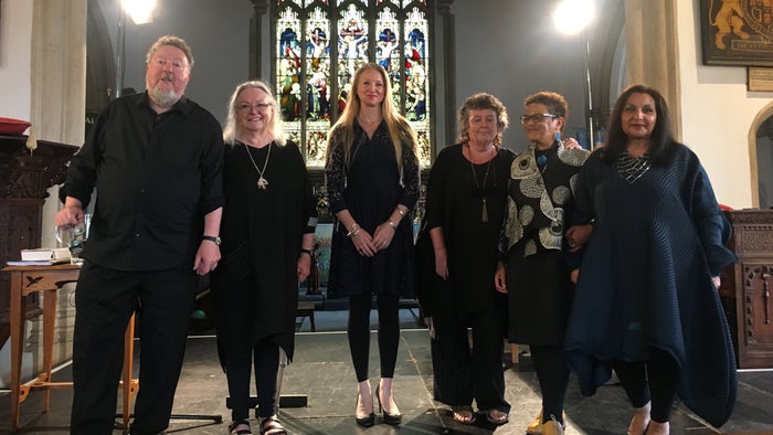 The poets on stage in the church