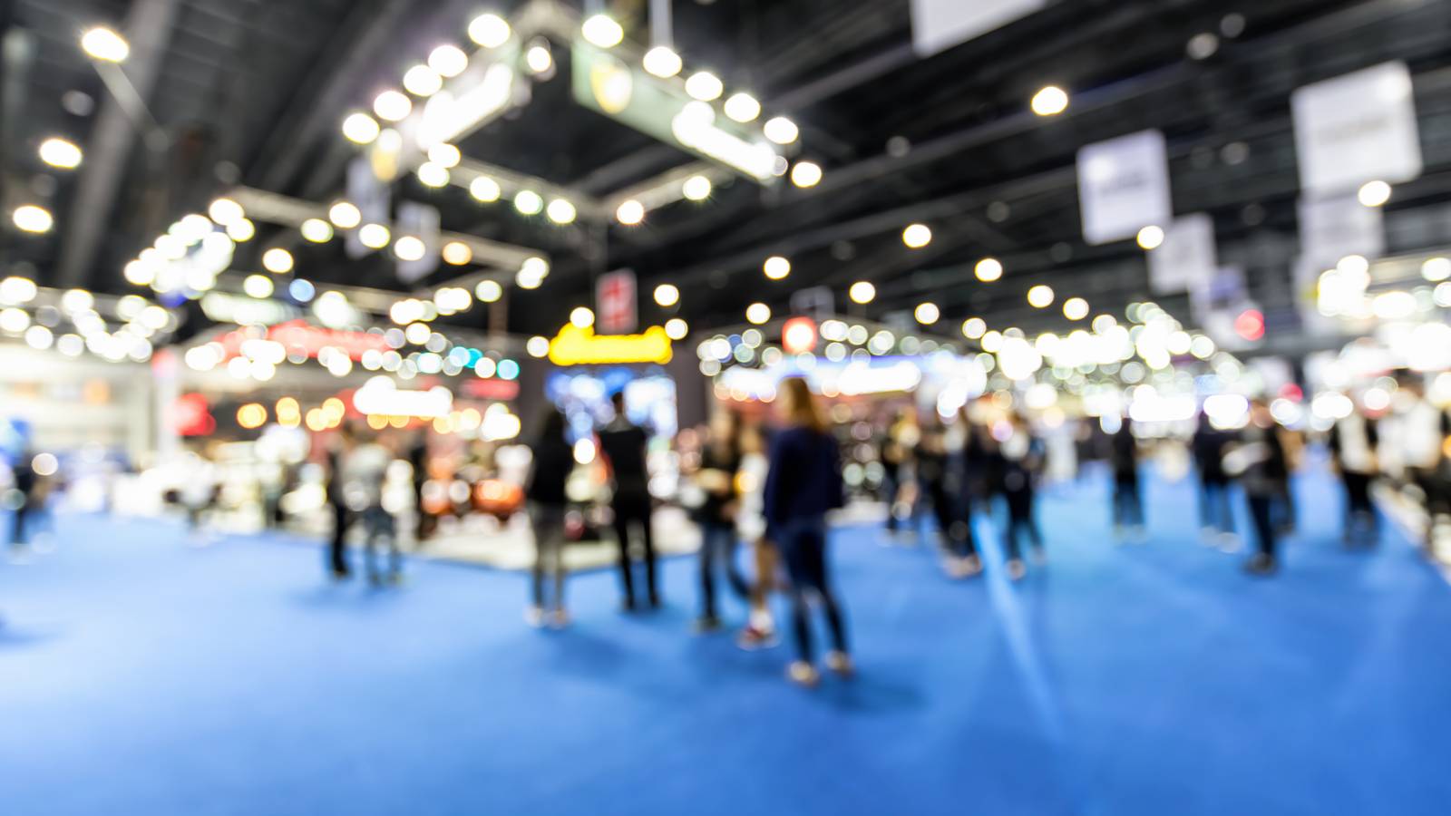A blurred image of a convention.
