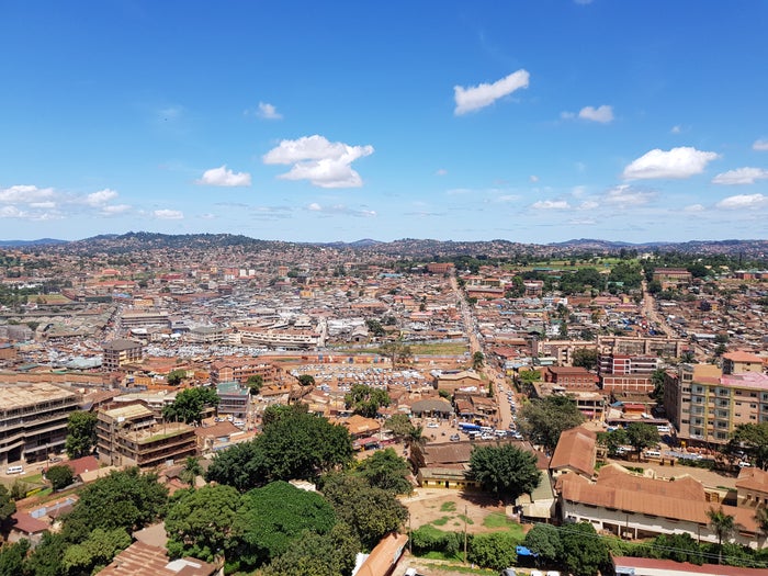 Kampala city centre seen from above, with the hills in the distance