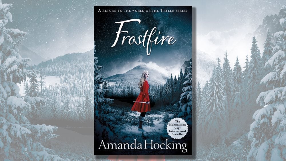Frostfire book cover with a snowing alpine forest in the background