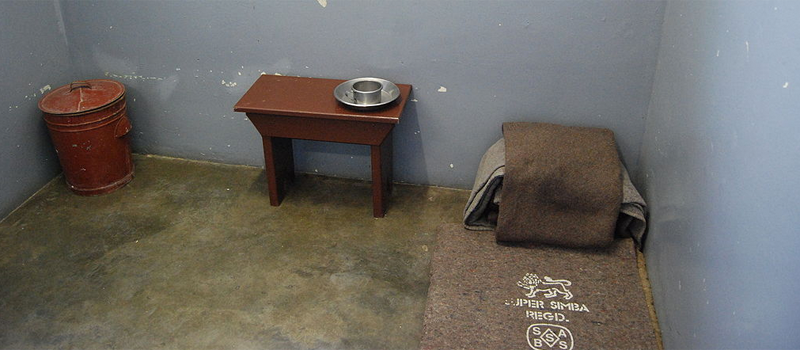 Photograph showing the inside of Nelson Mandela's prison cell