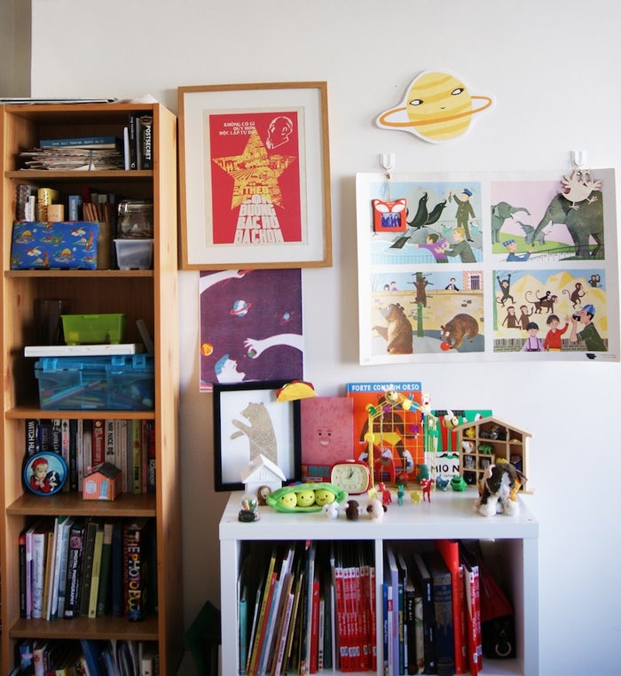 Artist's book collection and studio wall