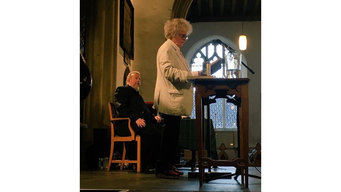 Maggi Hambling on stage introducing the event