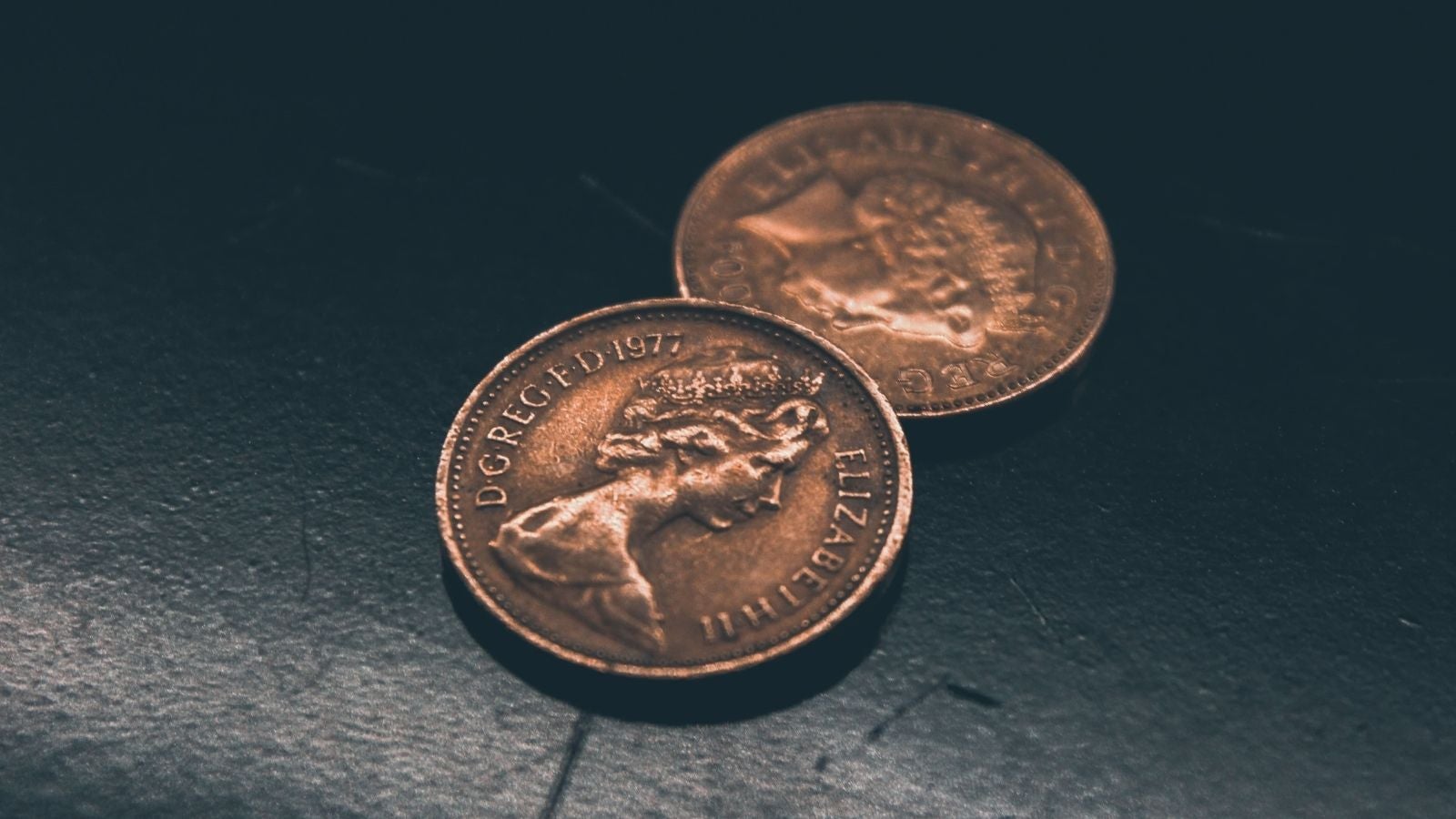 Two British pennies showing the head of Queen Elizabeth II 