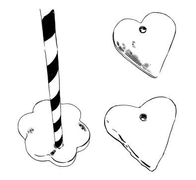 An illustration of two heart shaped salt-dough tags, and a straw puncturing a hole through a flower-shaped salt-dough tag