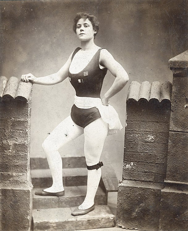 A black and white photograph of Miriam Kate Williams wearing white tights and a black leotard.