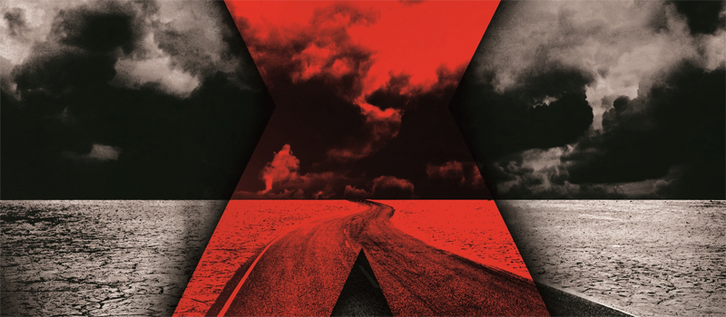 Close up of Sue Grafton's book, X, shwing a red X across the dusty landscape of a country road