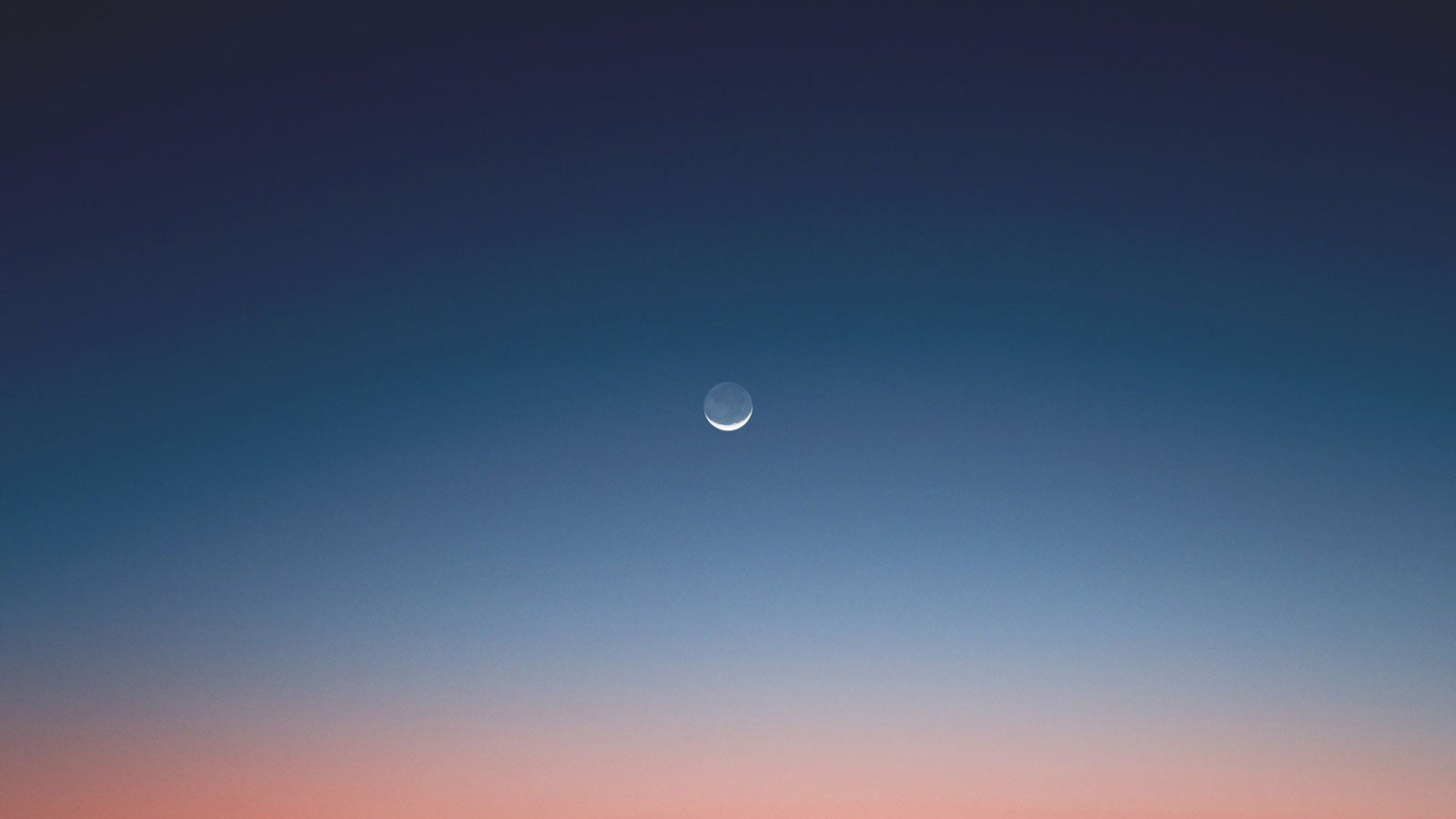 Crescent moon in the sky at dusk