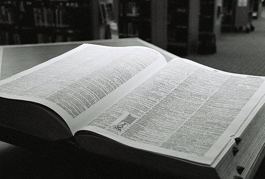 Large dictionary open on a table in a library