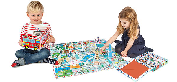 Two young children playing with a Campbell London map.