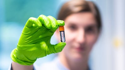 Lab workers shows his work Lab workers shows his work