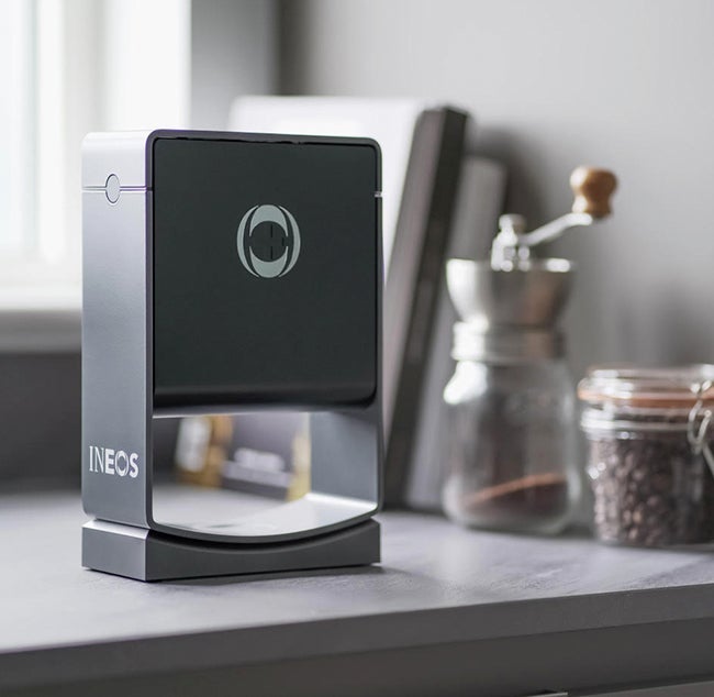 INEOS Dispenser sat on tabletop is a home kitchen next to coffee beans and grinder