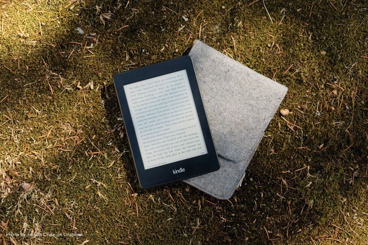 Photo of a Kindle laying on the grass