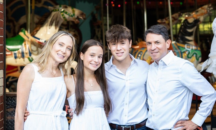 Max with his family, all wearing white clothes (from left to right: Max's mother, Max's sister, Max himself and his father). Max with his family, all wearing white clothes (from left to right: Max's mother, Max's sister, Max himself and his father).
