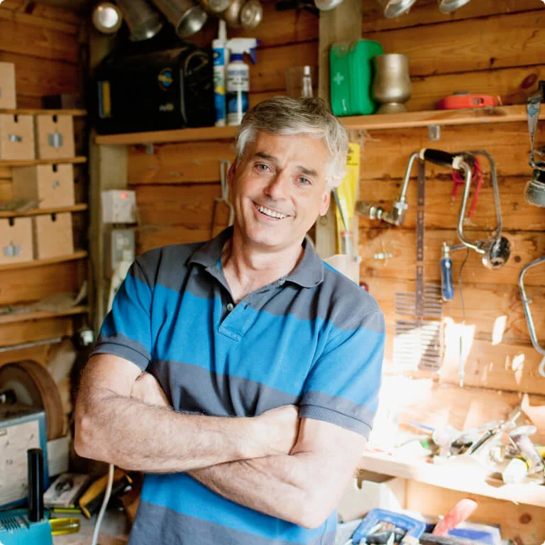 Man smiling in his shed
