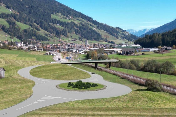 Das neue Projekt für die Eisenbahnüberführung in innichen präsentiert sich landschaftlich schonend mit einer schlichten Brücke , die durch Infrastrukturbeiträge aus dem Olympiafond relativ schnell realisierbar wäre. (Rendering: Mobilitätsressort)