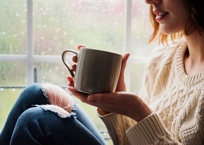 Young woman holding a mug