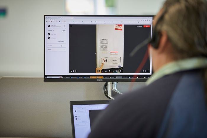 Person sat in front of a computer monitor