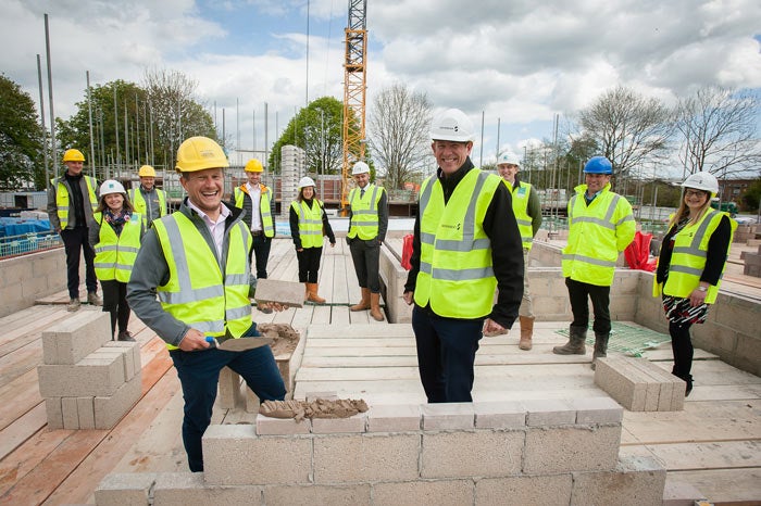 A team of people on the development site in Yate