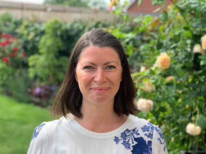 Heidi Leyshon, Communities Manager in a flower garden