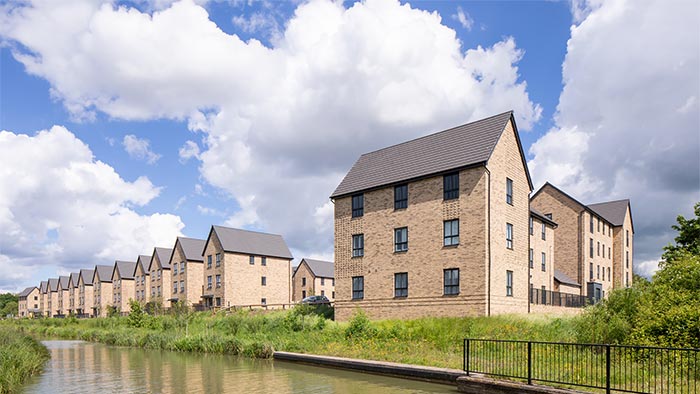 Modern houses next to a river bank