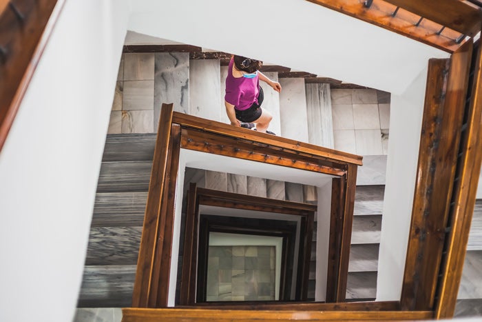 Looking down a staircase with a person walking down